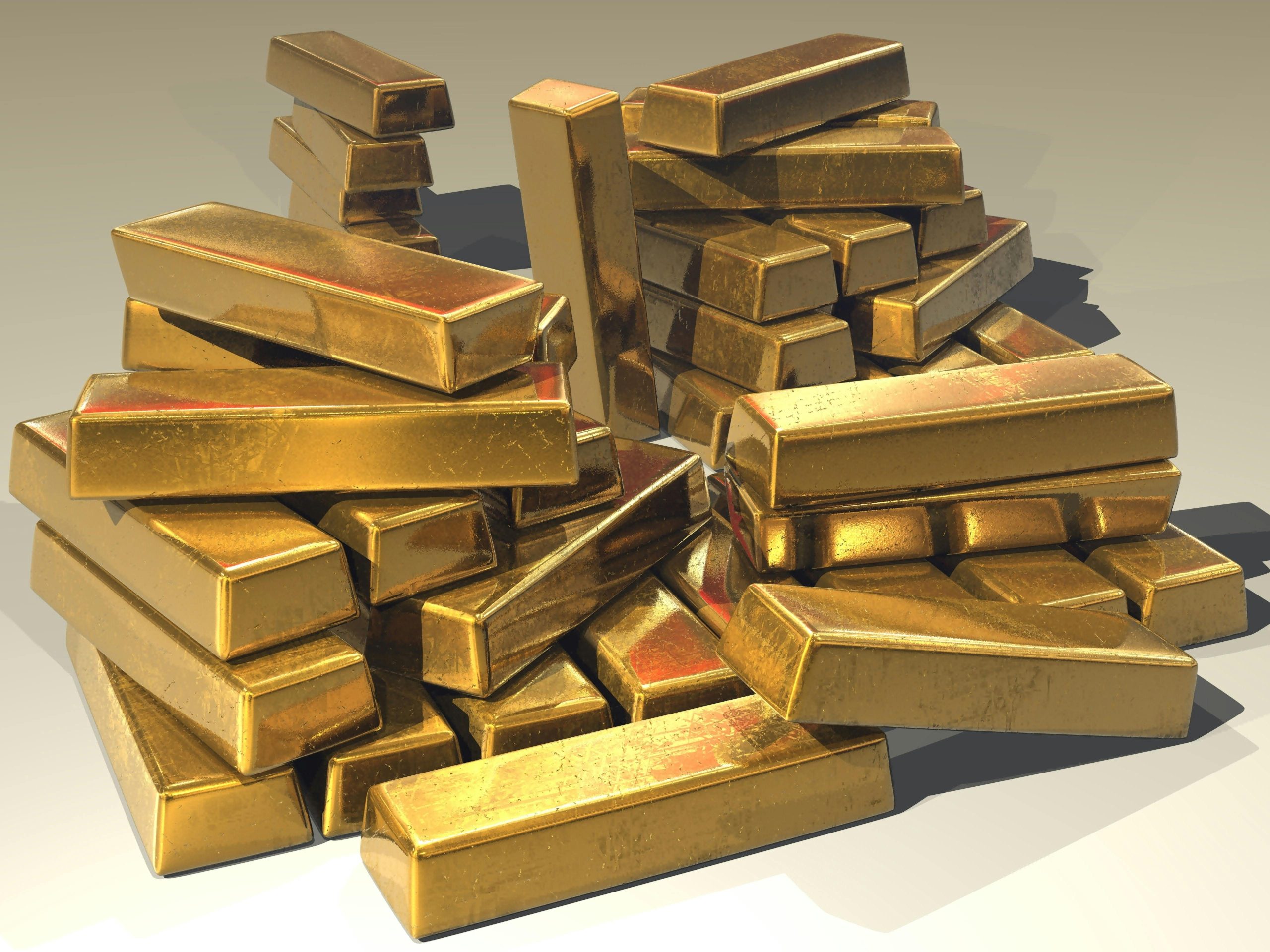 A pile of lustrous gold bars symbolizing wealth and prosperity.