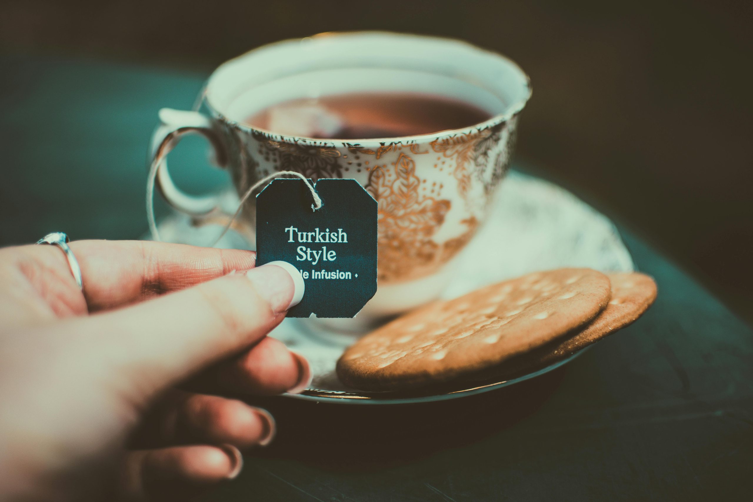 Warm cup of Turkish style tea with biscuits, a perfect indoor cozy moment.