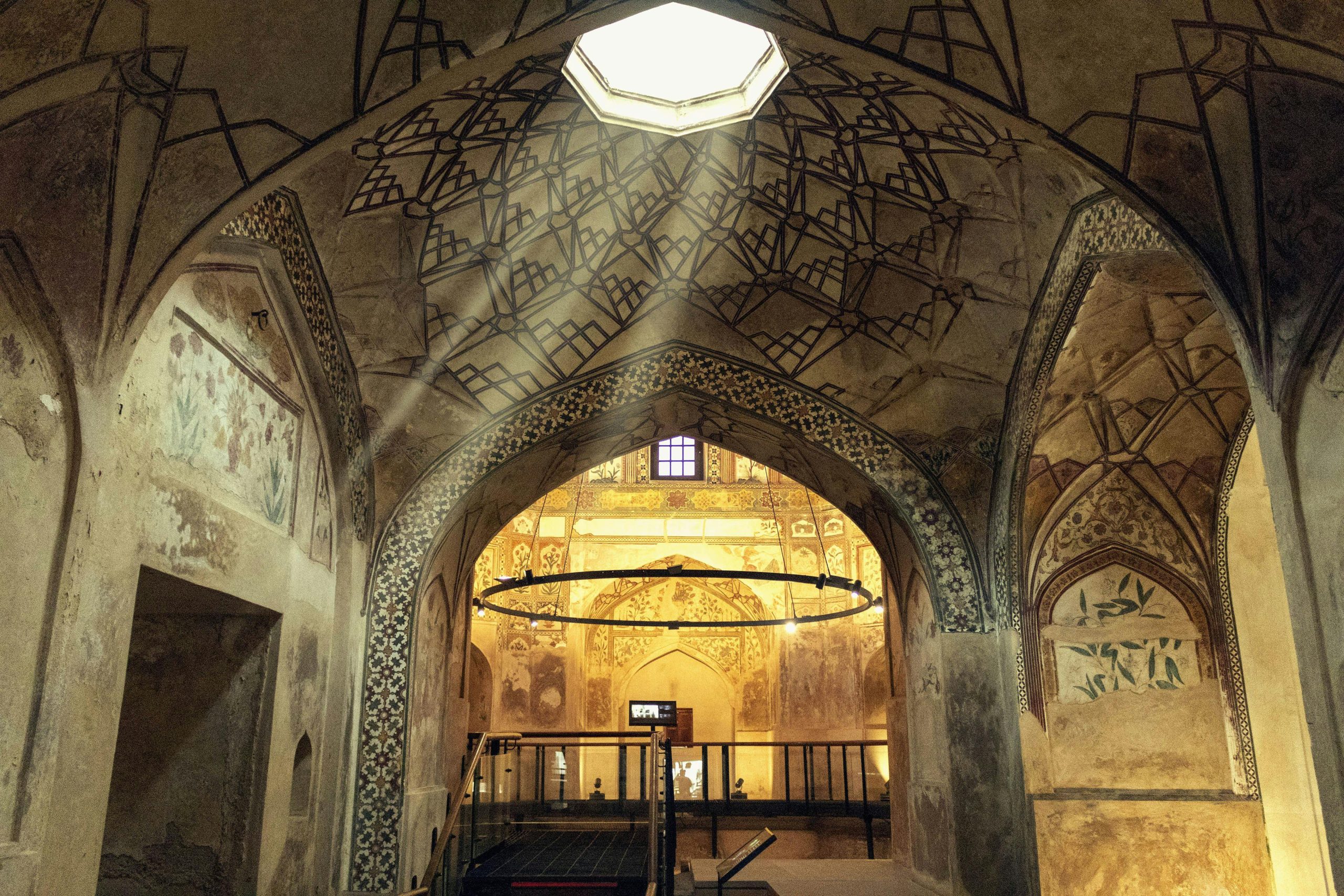 Discover the intricate details and skylight of a historic Mughal architectural site.