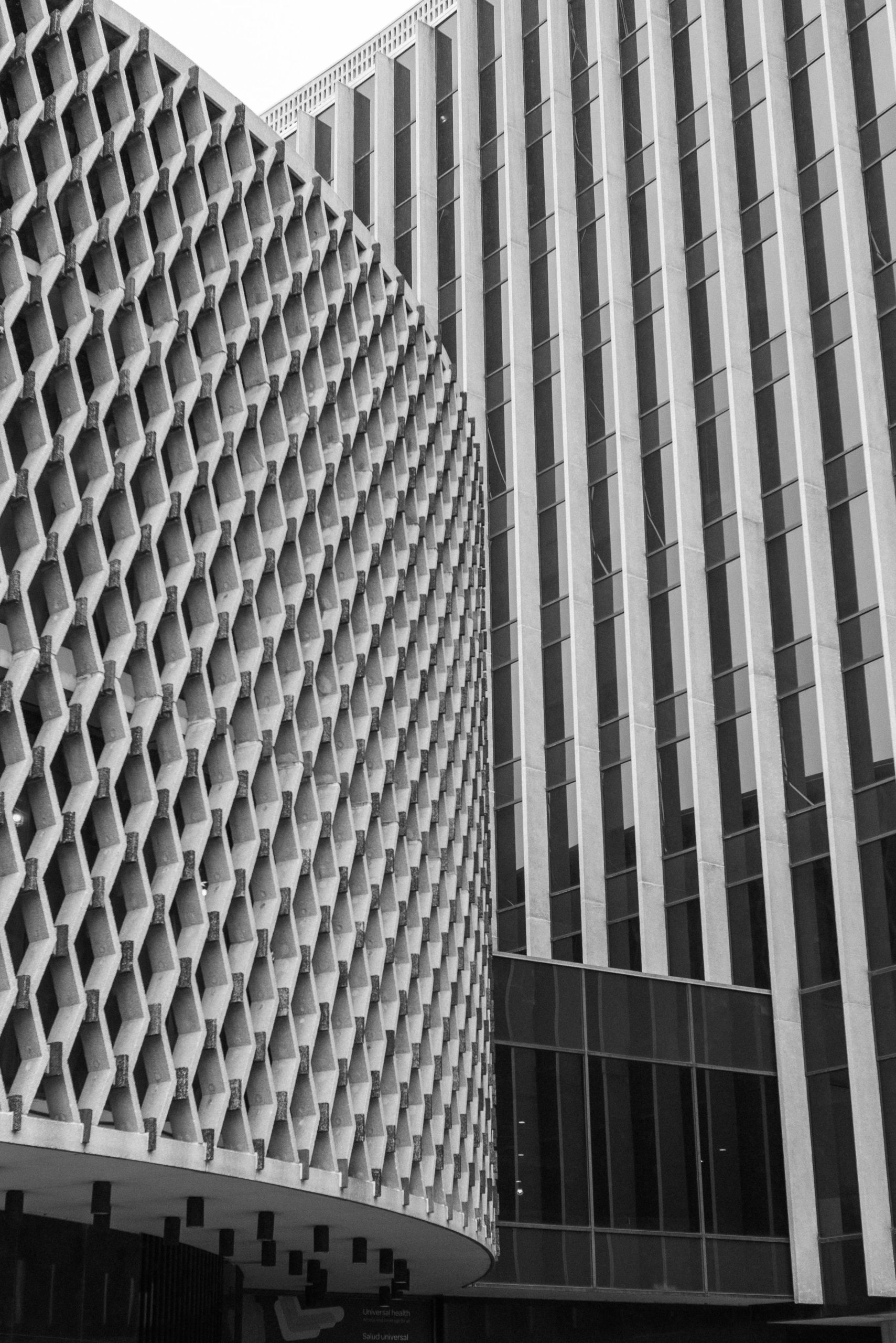 Striking black and white image of city architecture showcasing geometric patterns and modern design.