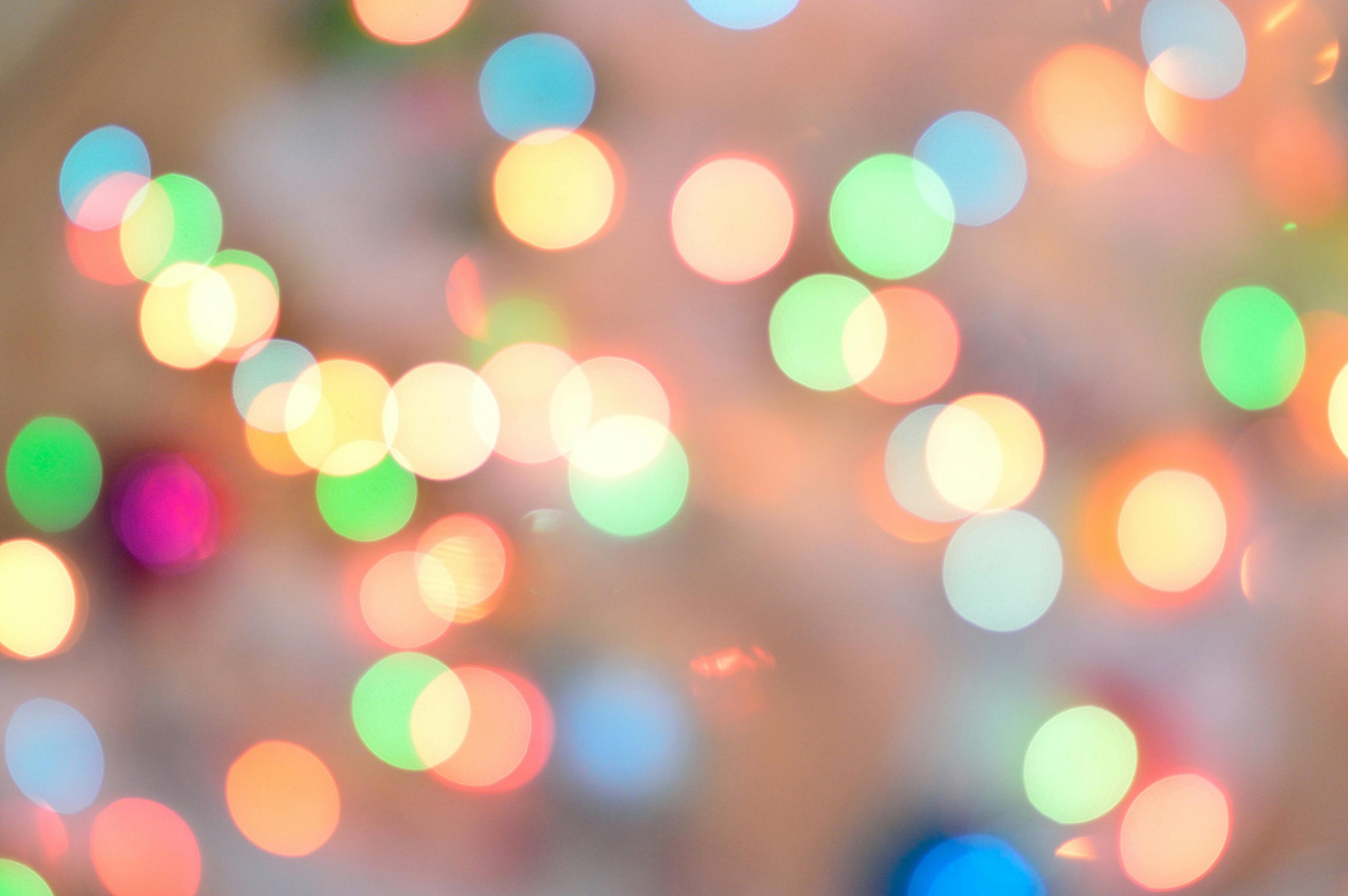 Vibrant abstract image with colorful bokeh lights creating a festive atmosphere.