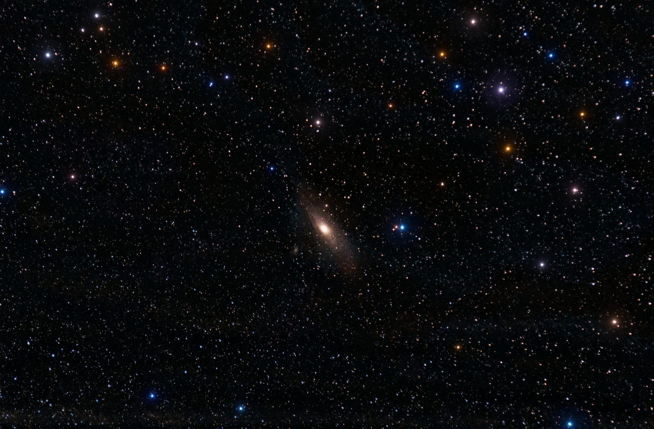 A breathtaking view of the Andromeda Galaxy surrounded by vibrant stars in the night sky.